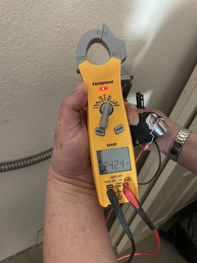 Voltage testing with clamp meter during Generator Installation in Culver City